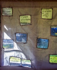 a piece of cloth with a lot of writing on it