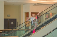 a woman on an escalator
