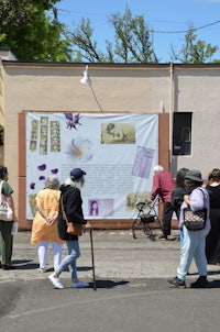 a group of people walking down the street