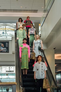 a group of people on an escalator